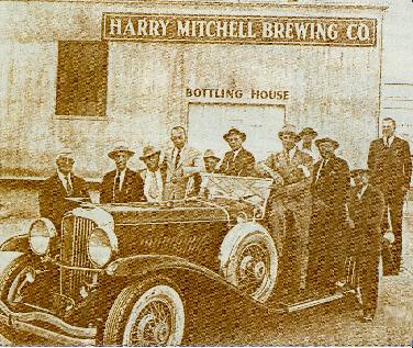 Harry Mitchell (right, on running board).